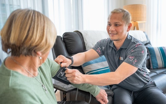 Support worker providing dedicated in-home care assistance
